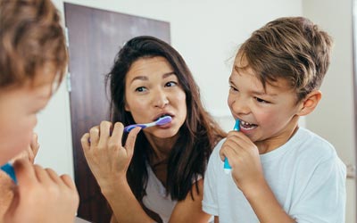 family brushing teeth - dentists orders for kids