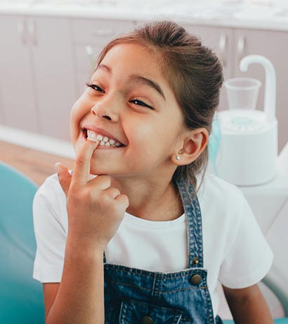 kid smiling at the dentists office