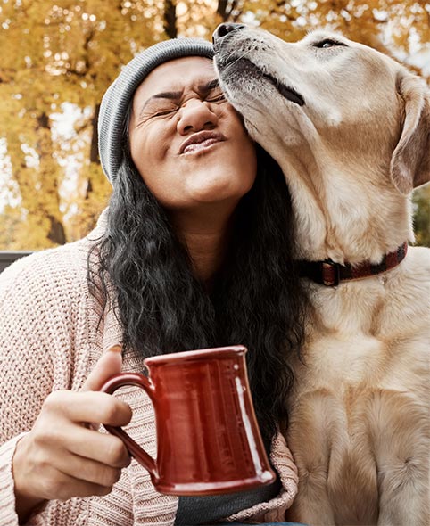 happy Massachusetts resident with her dog